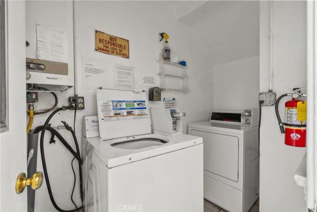 a view of storage and utility room with washer and dryer