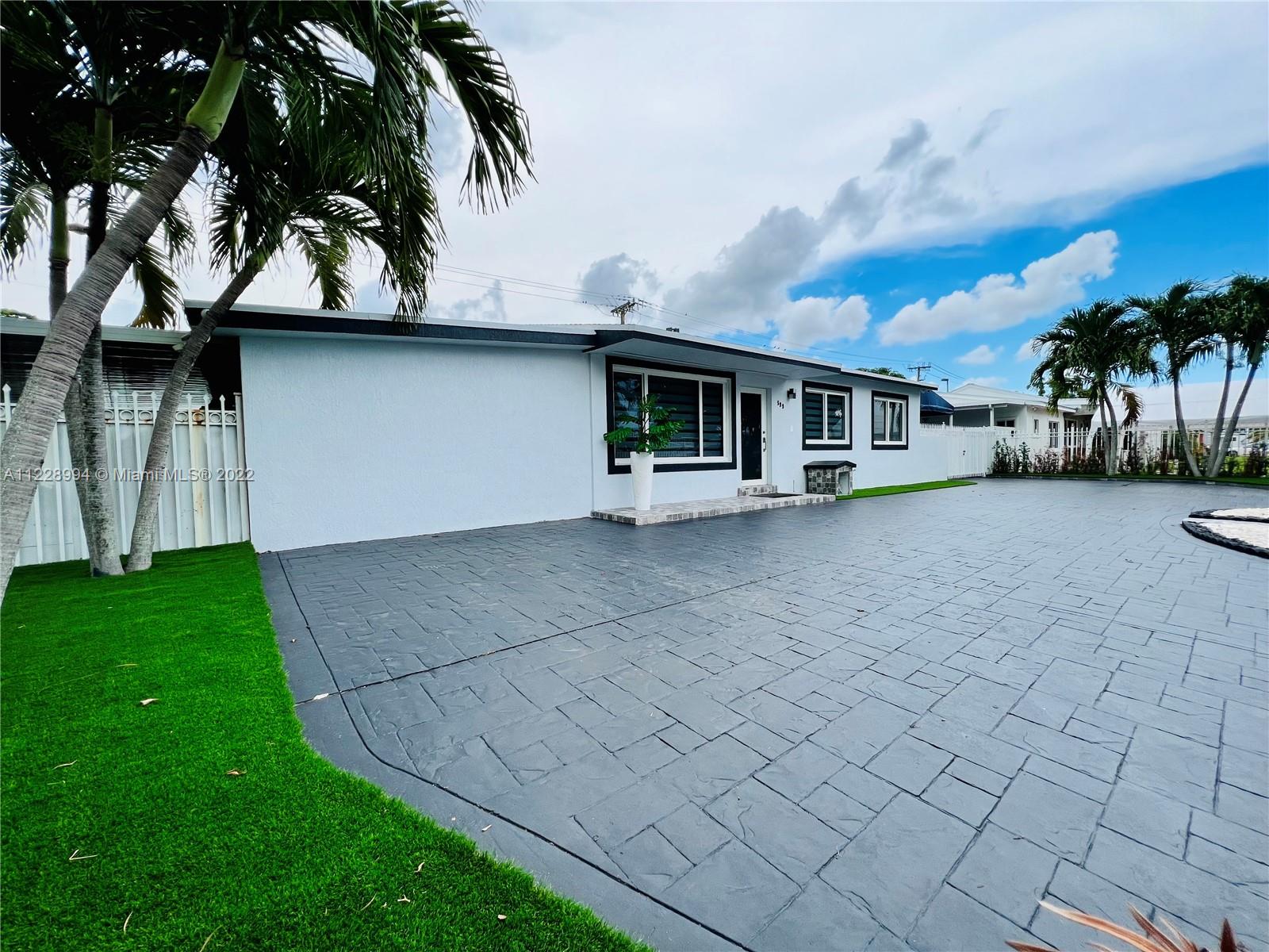 599 West 46th Place Hialeah, FL 33012 - Photo 1 of 25 a view of a house with a yard