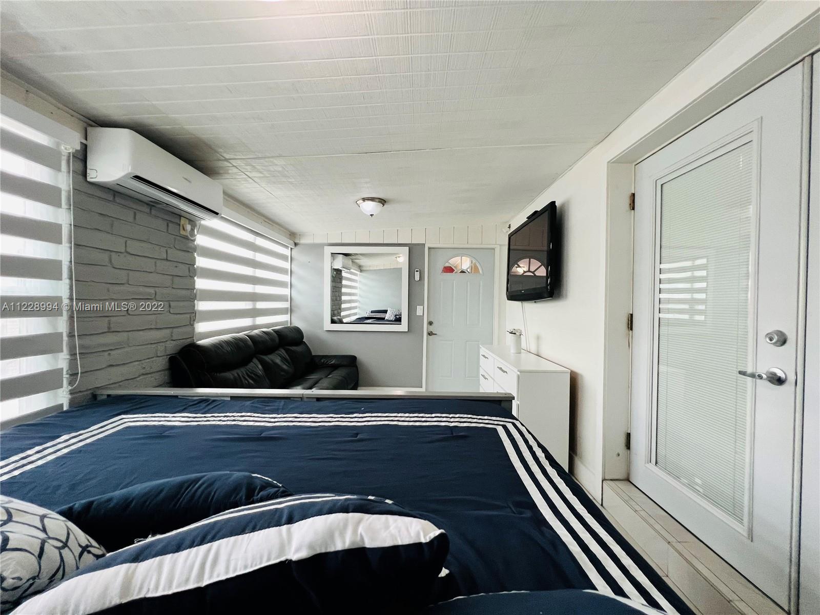 599 West 46th Place Hialeah, FL 33012 - Photo 13 of 25 a kitchen with a sink and wooden floor