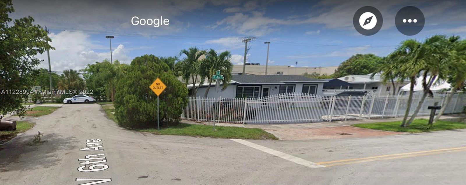 599 West 46th Place Hialeah, FL 33012 - Photo 23 of 25 a front view of a house with a yard