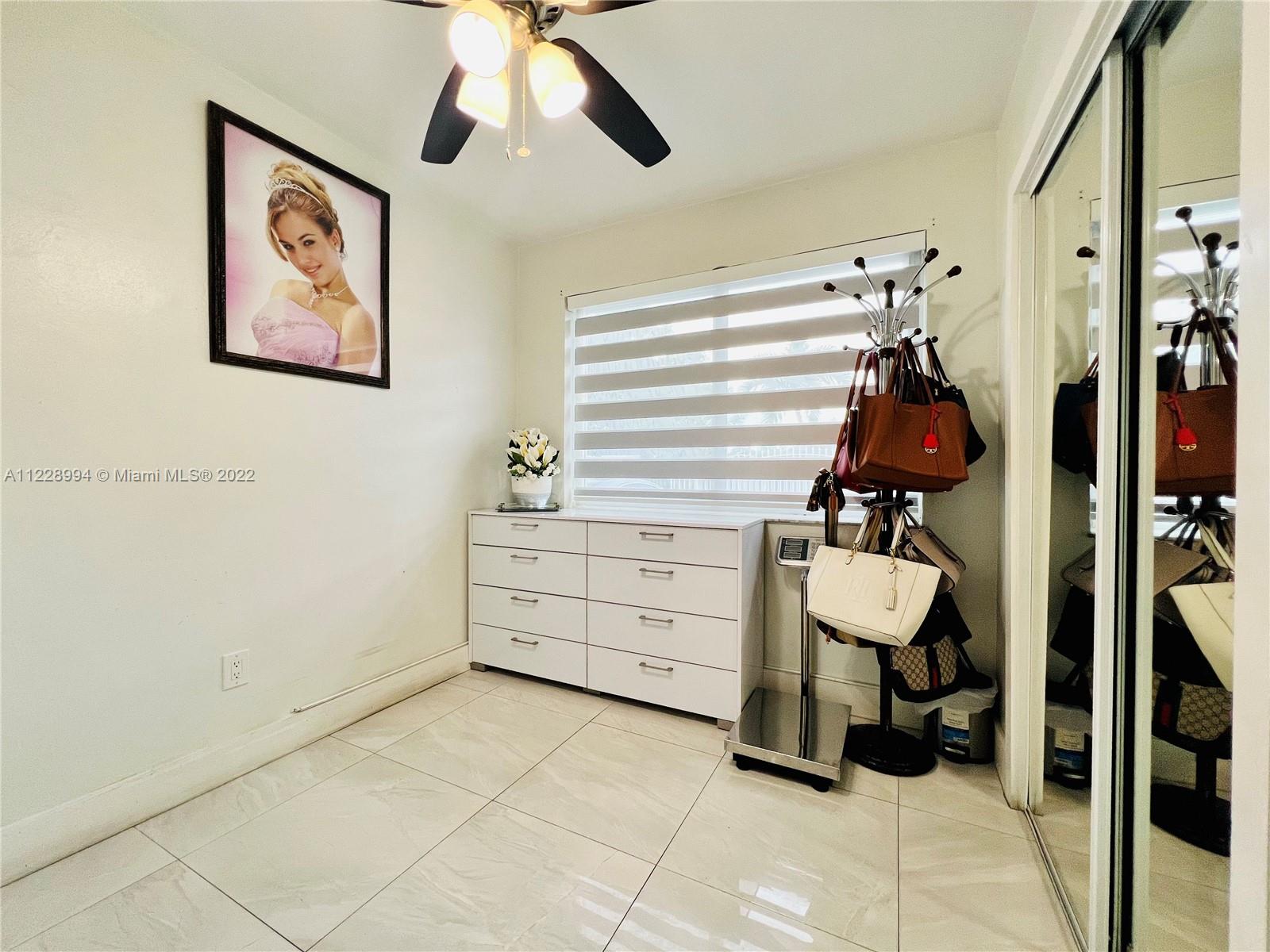 599 West 46th Place Hialeah, FL 33012 - Photo 10 of 25 a room with gym equipment and view of living room