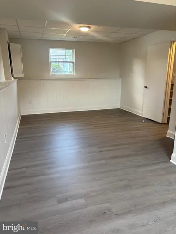 a view of an empty room and wooden floor