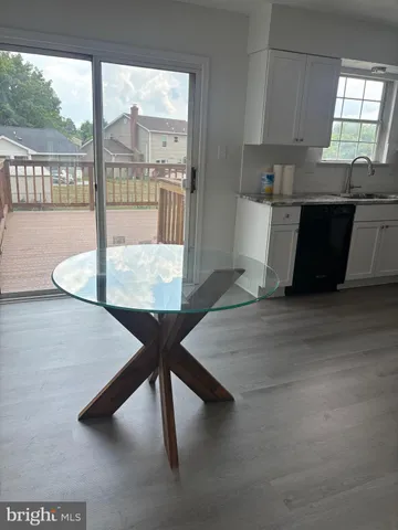 a dining room with table and chairs