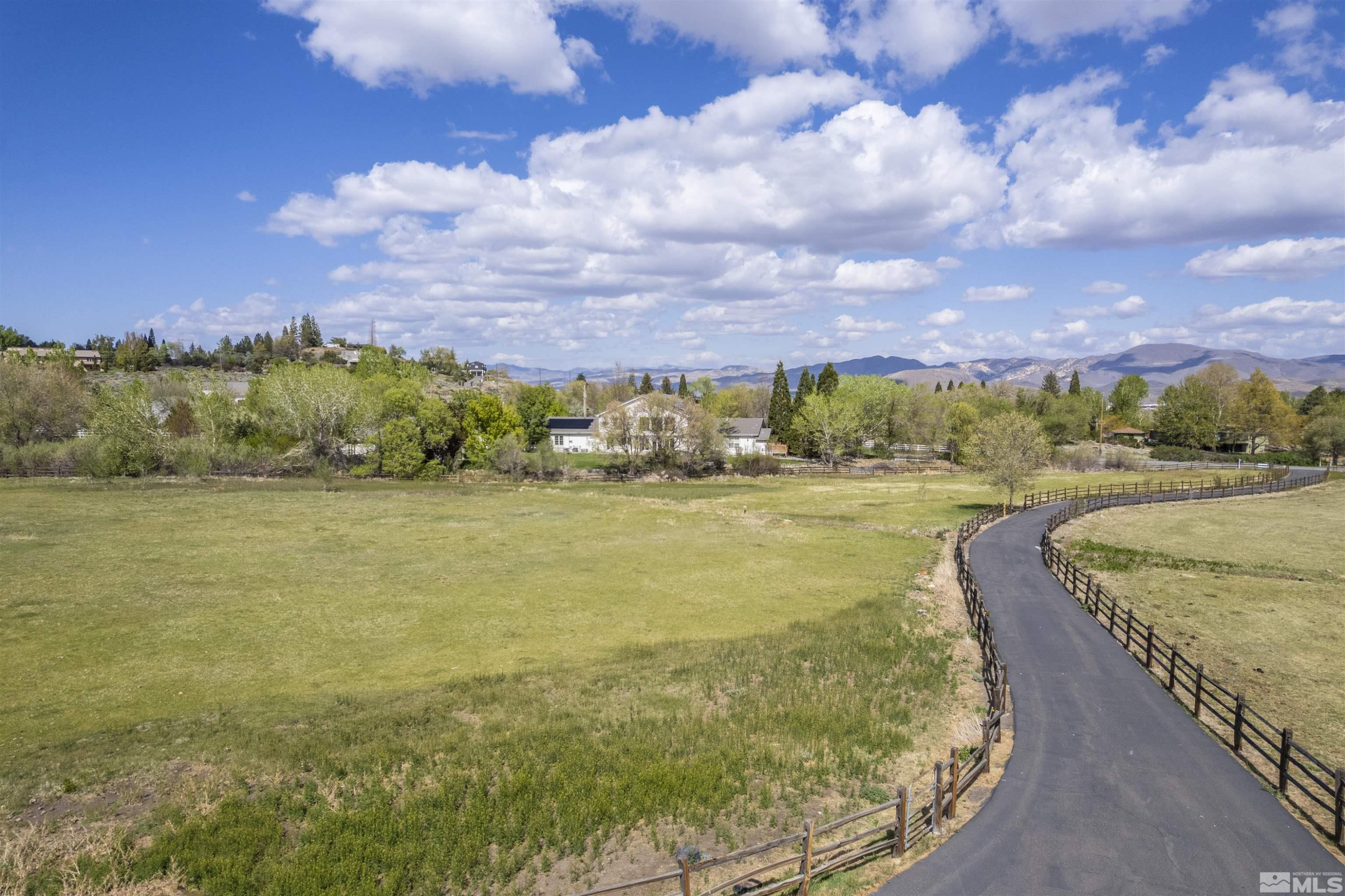 0 Lakeside Drive Reno, NV 89511 - Photo 4 of 8 a view of a lake with a building in the background