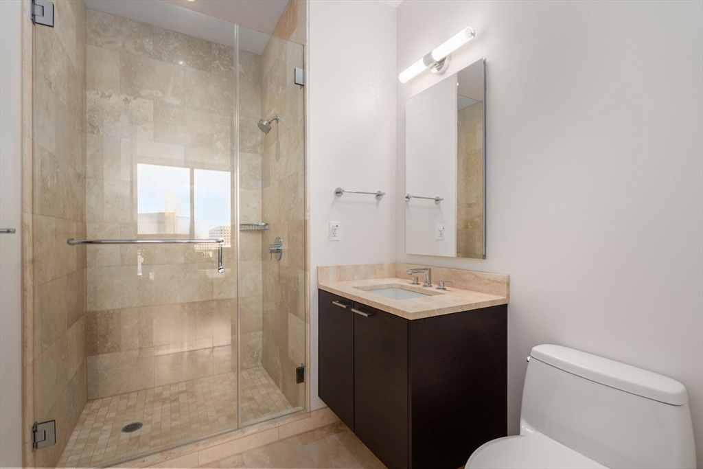 1 Franklin Street, Unit 4704 Boston, MA 02110 - Photo 16 of 33 a bathroom with a sink toilet and shower
