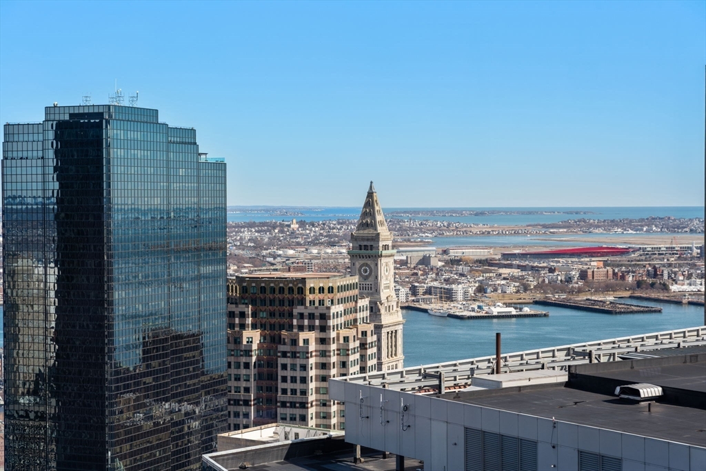 1 Franklin Street, Unit 4704 Boston, MA 02110 - Photo 4 of 33 a view of a balcony with an ocean view