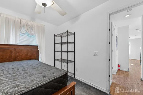 a view of livingroom with hardwood floor and cabinet