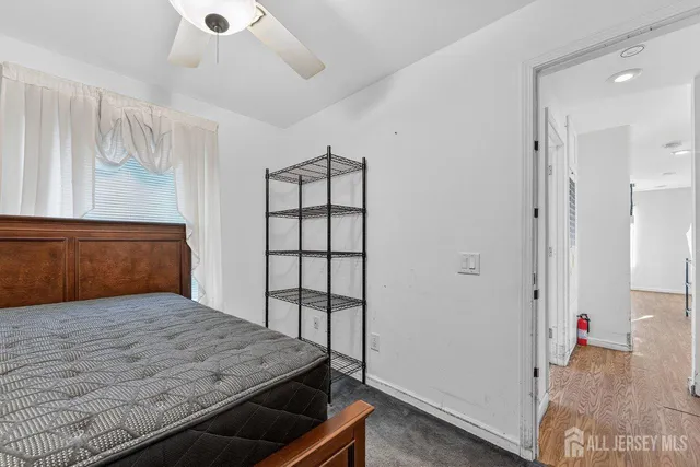 a view of livingroom with hardwood floor and cabinet