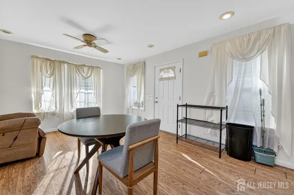 a living room with furniture a fireplace and a table