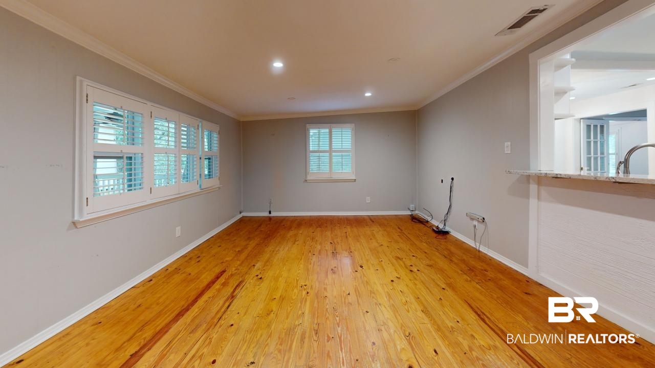48 Hathaway Road West Mobile, AL 36608 - Photo 14 of 40 Unfurnished room with light hardwood / wood-style flooring, ornamental molding, and sink
