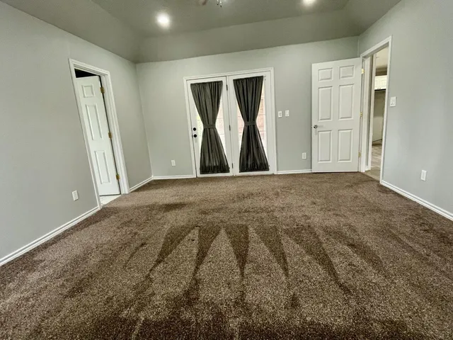 a view of empty room with windows