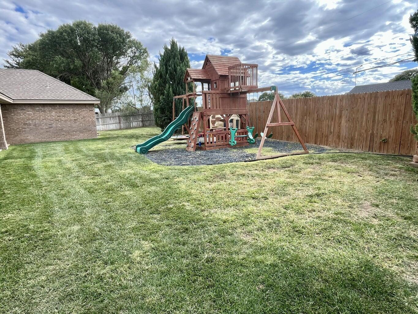 1415 Ebeling Drive Plainview, TX 79072 - Photo 36 of 46 a view of a house with a backyard