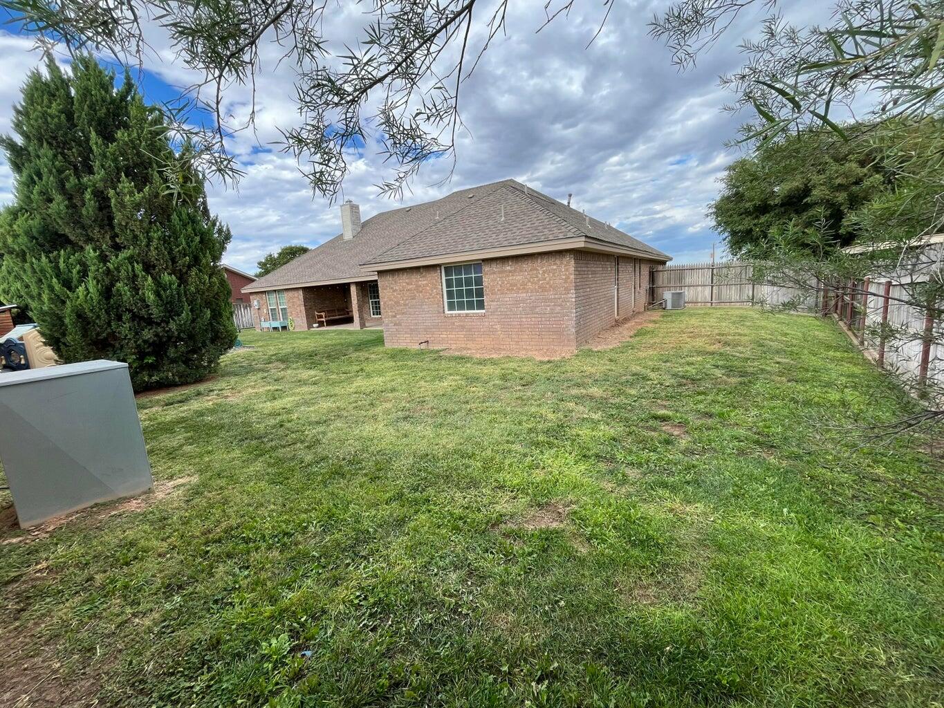 1415 Ebeling Drive Plainview, TX 79072 - Photo 39 of 46 a view of a house with yard and a garden
