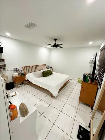 a bedroom with a bed and a table in it