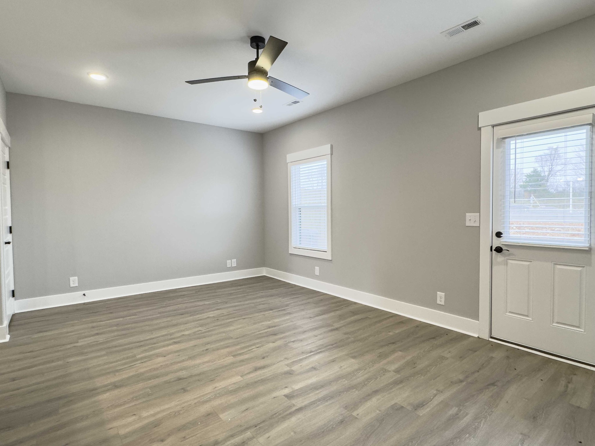 404 Jonathan Wade Circle Clarksville, TN 37043 - Photo 11 of 25 a view of an empty room with wooden floor and a window