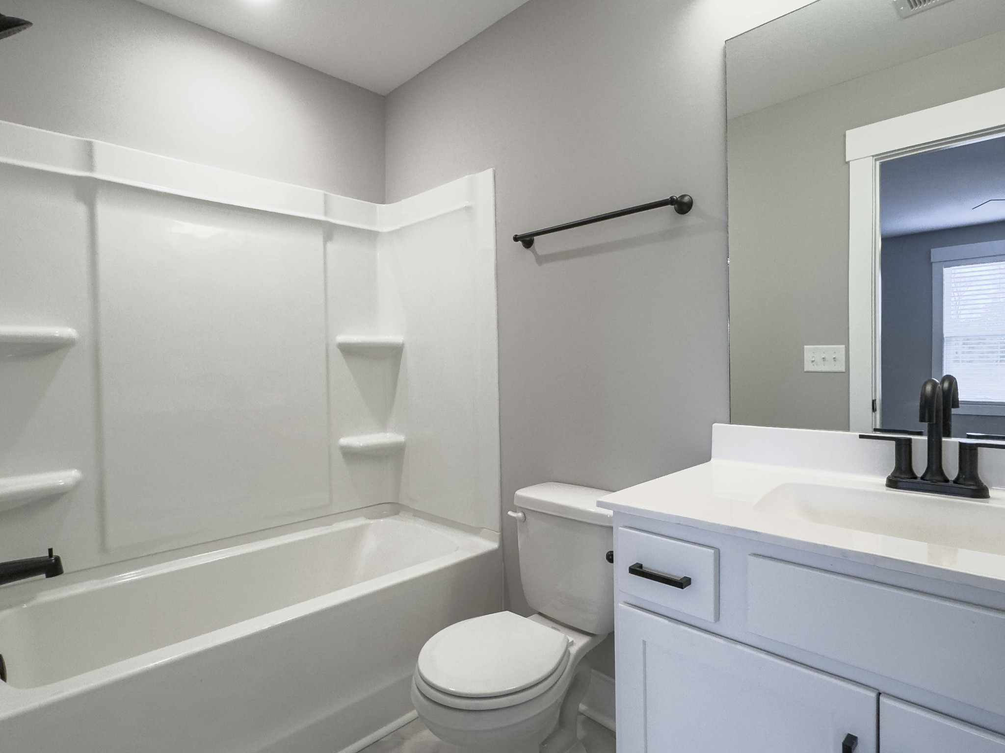 404 Jonathan Wade Circle Clarksville, TN 37043 - Photo 17 of 25 a bathroom with a sink toilet vanity and shower