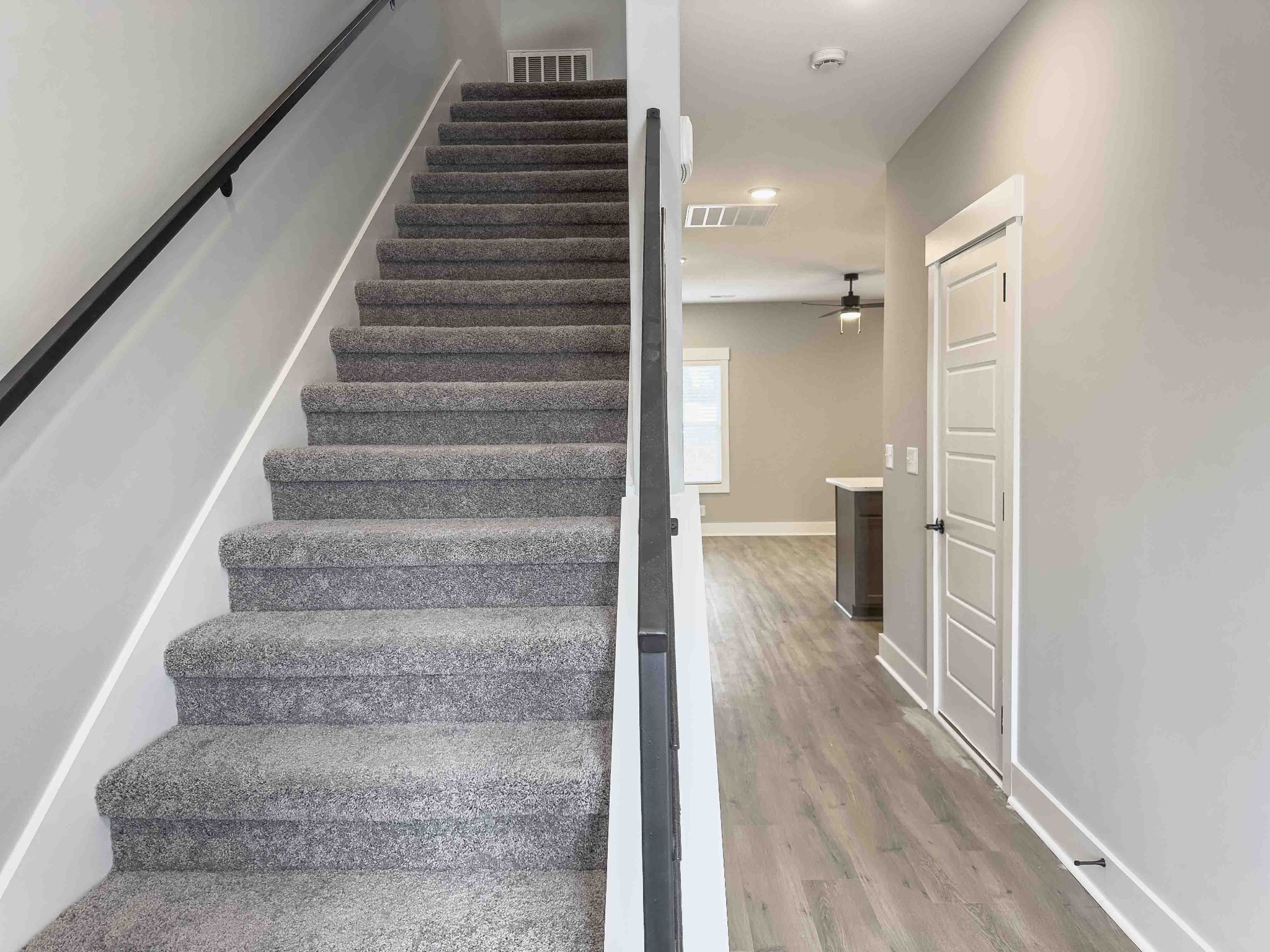 404 Jonathan Wade Circle Clarksville, TN 37043 - Photo 3 of 25 a view of a hallway with wooden floor and staircase