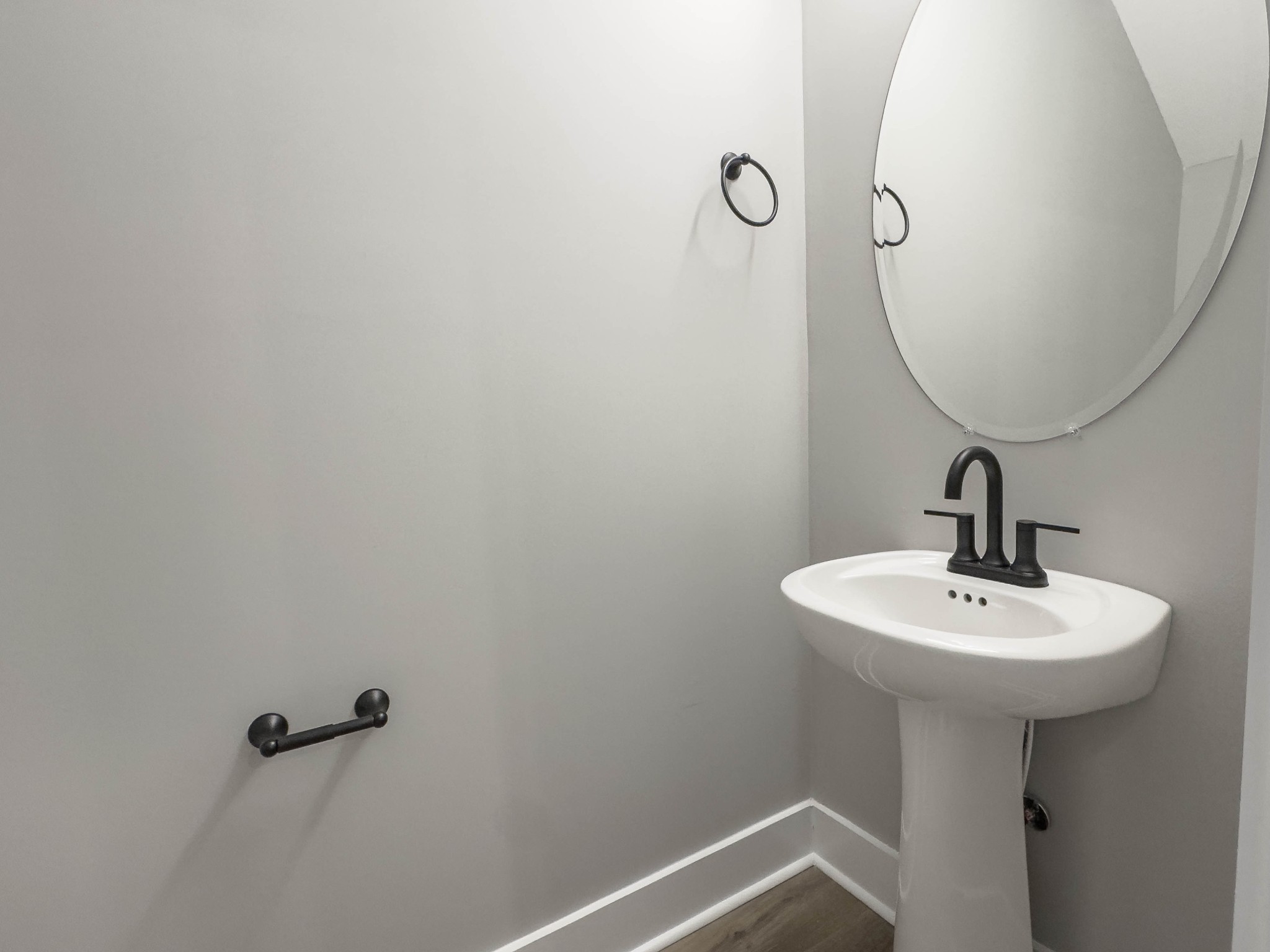 404 Jonathan Wade Circle Clarksville, TN 37043 - Photo 4 of 25 a bathroom with a sink a mirror and toilet
