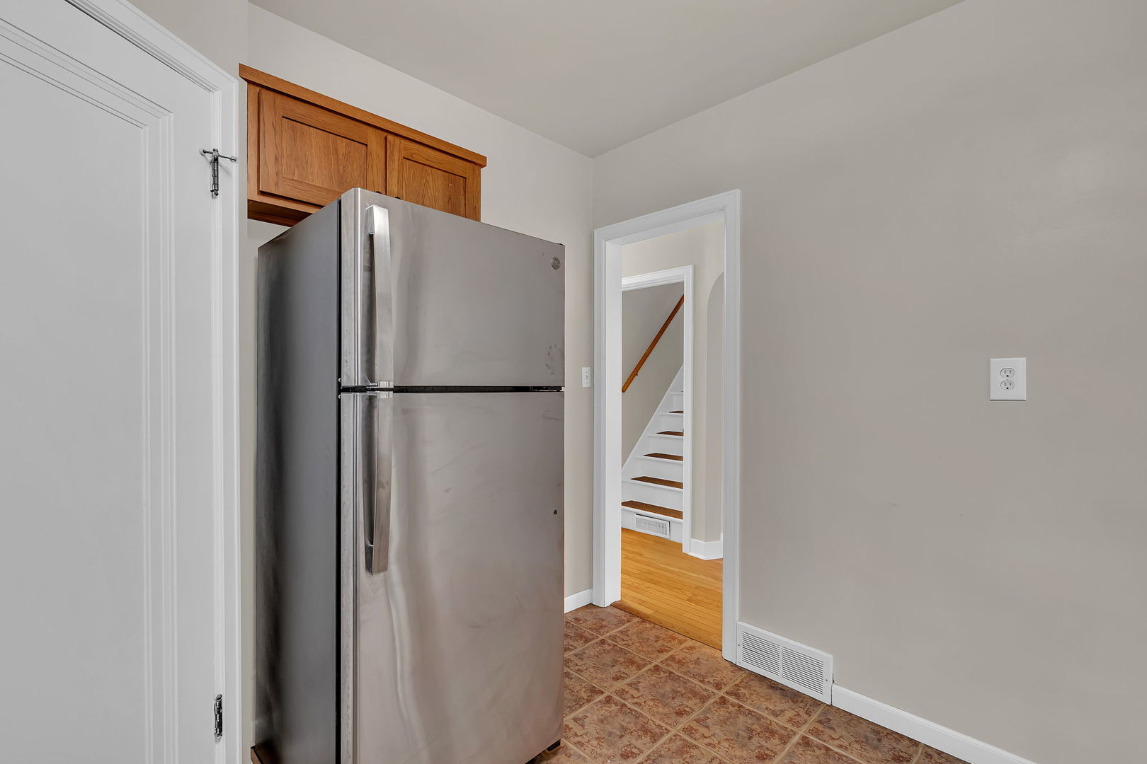 405 West Bluff Street Streator, IL 61364 - Photo 14 of 31 a view of hallway with wooden floor and a refrigerator
