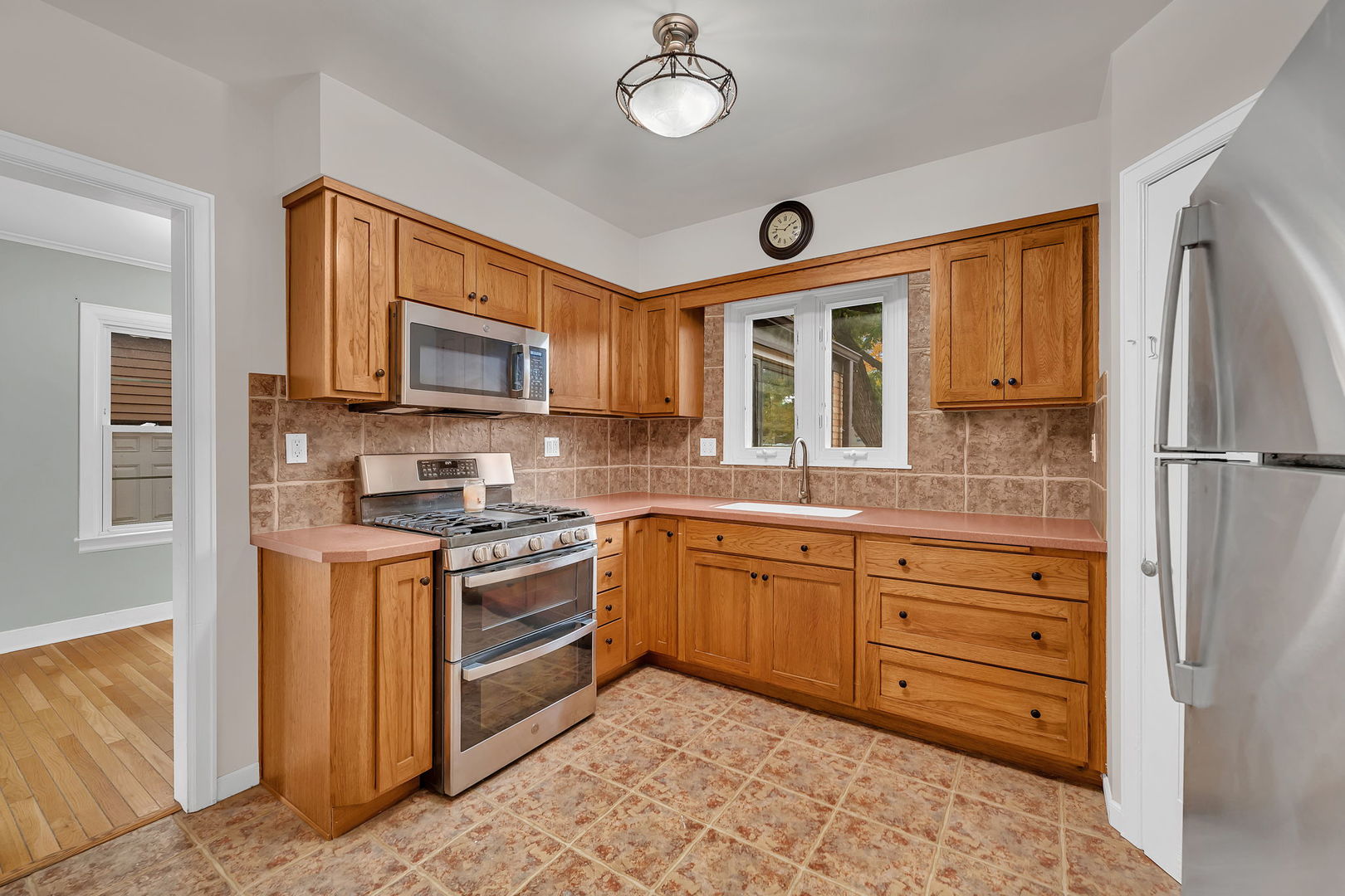 405 West Bluff Street Streator, IL 61364 - Photo 15 of 31 a kitchen with stainless steel appliances granite countertop a stove and a sink