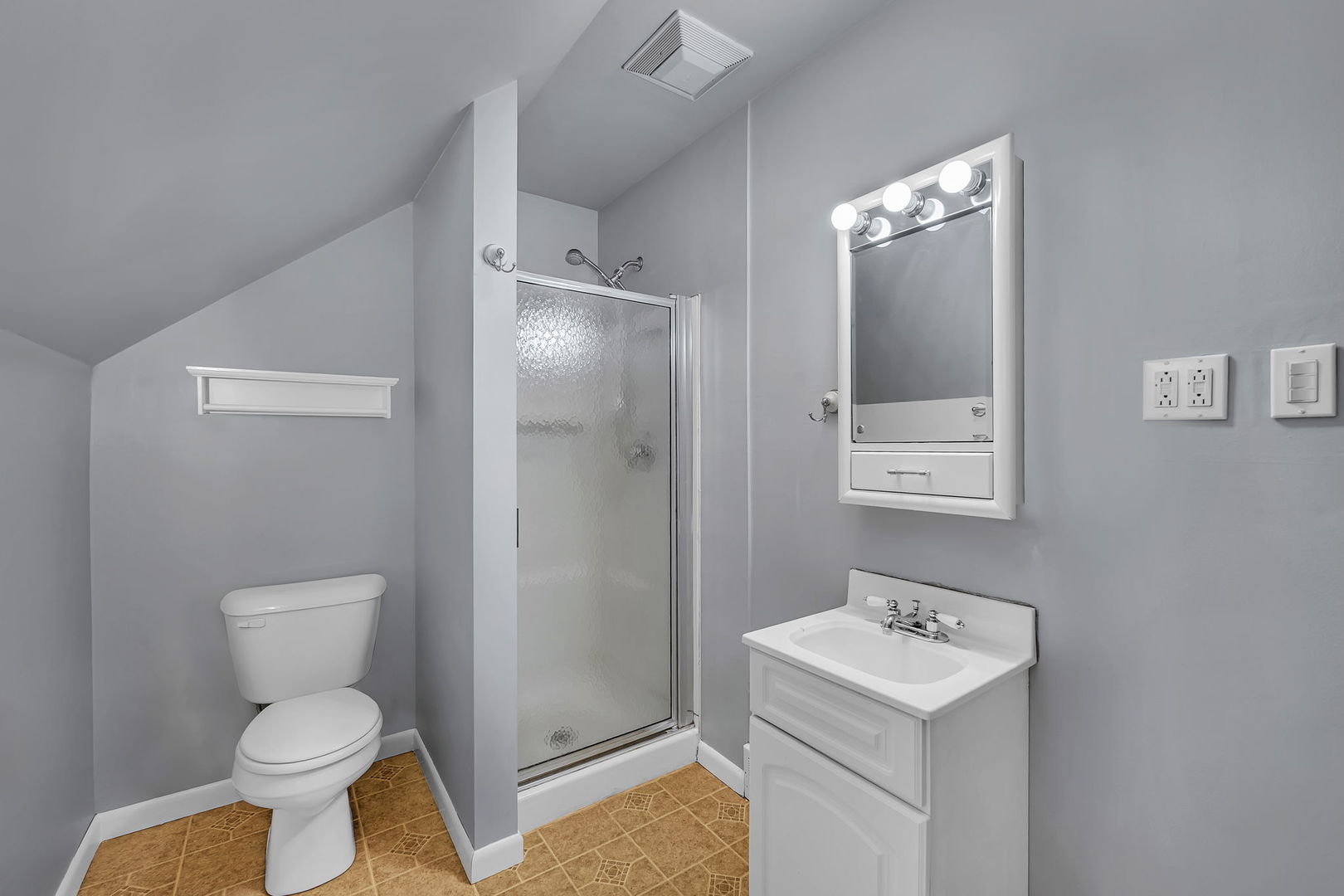 405 West Bluff Street Streator, IL 61364 - Photo 21 of 31 a bathroom with a toilet sink and mirror