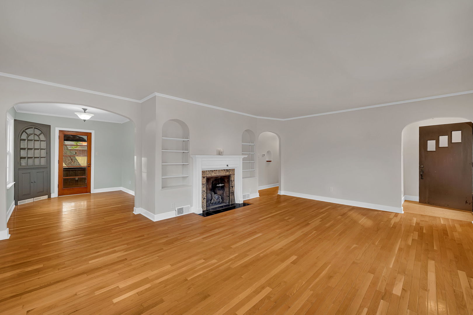 405 West Bluff Street Streator, IL 61364 - Photo 7 of 31 a view of empty room with wooden floor and fireplace