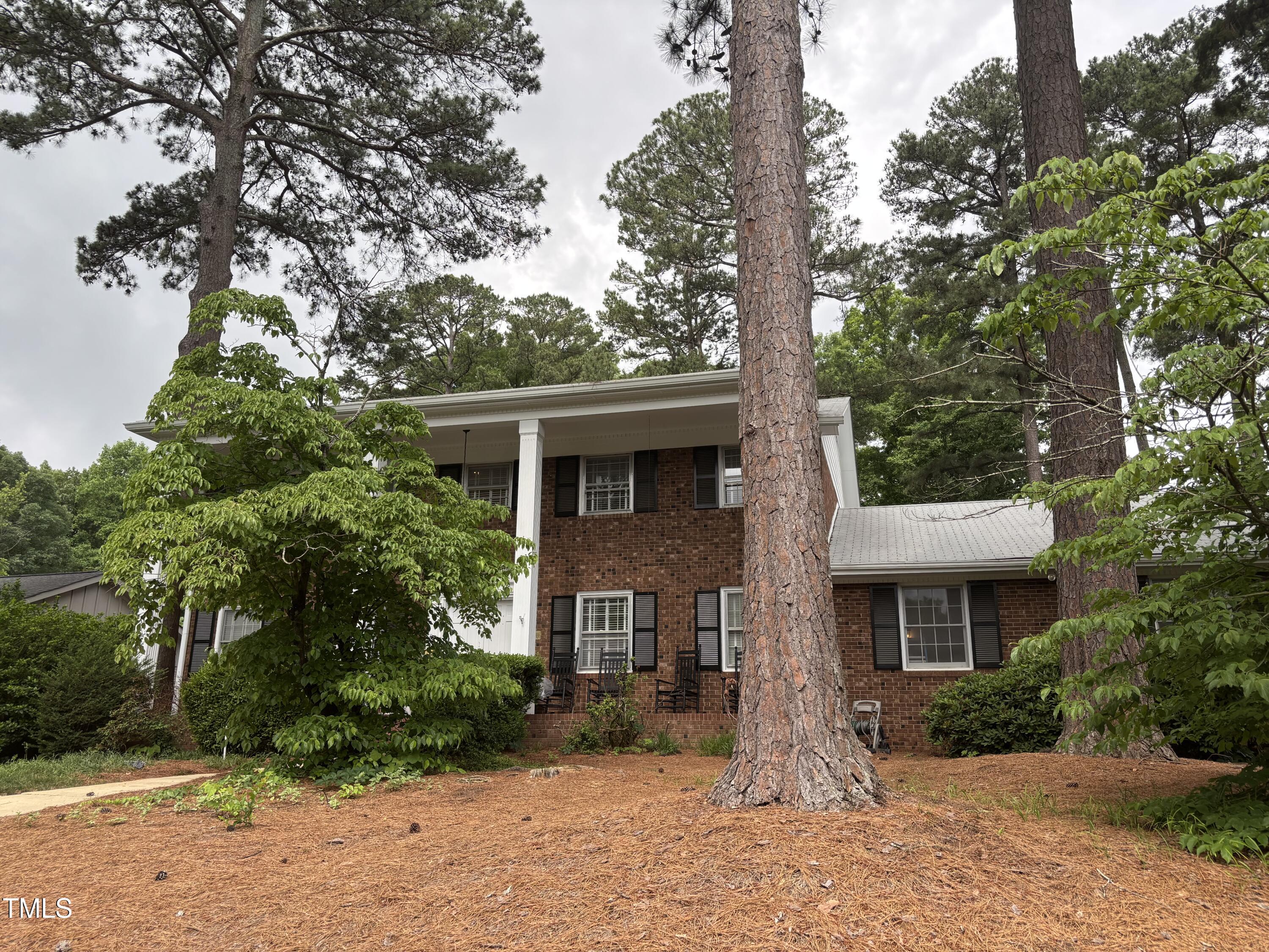 2213 Nancy Ann Drive Raleigh, NC 27607 - Photo 1 of 3 a front view of a house with a garden