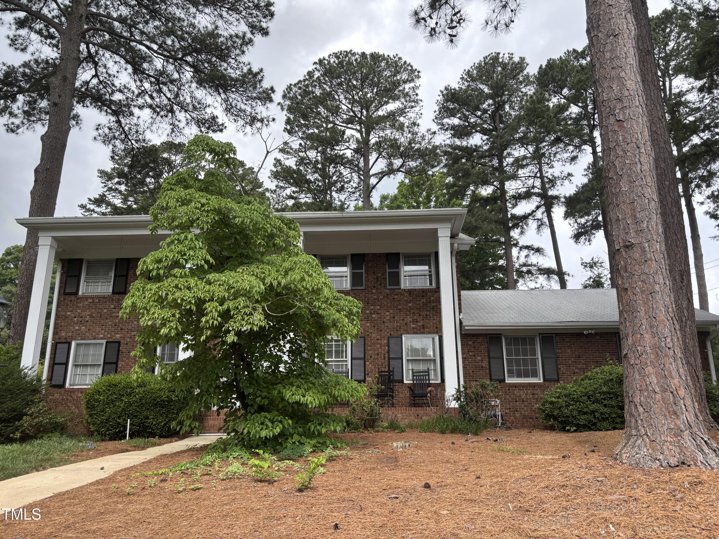 2213 Nancy Ann Drive Raleigh, NC 27607 - Photo 2 of 3 a front view of a house with garden