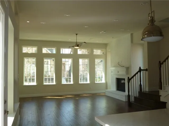 a view of an entryway with wooden floor