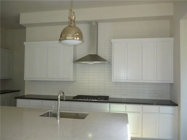 a bathroom with a sink and a window