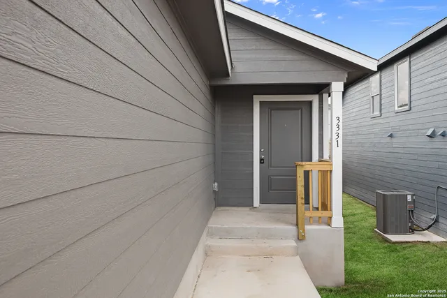 a kitchen with a sink and steel appliances