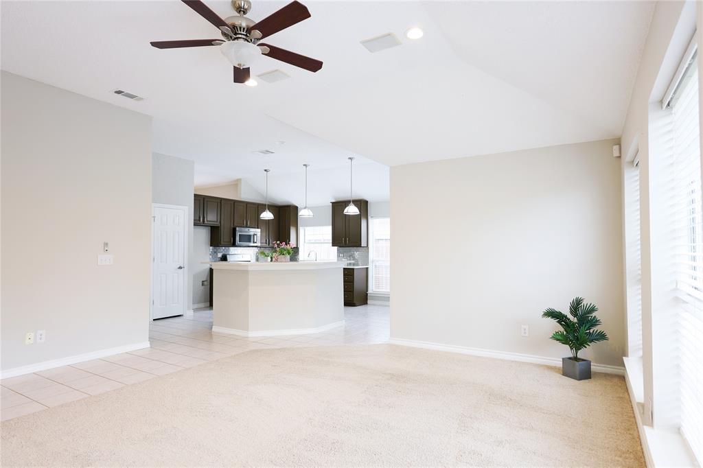 8112 Dock Street Frisco, TX 75035 - Photo 12 of 34 a view of a living room and kitchen with a sink