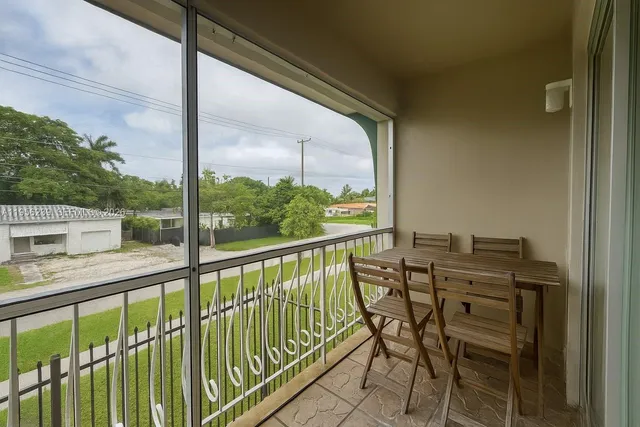 a view of a balcony with chairs