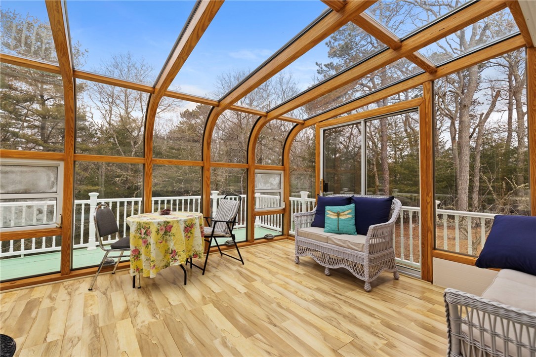 358 Shannock Road South Kingstown, RI 02879 - Photo 13 of 49 Sunroom overlooks wooded backyard.