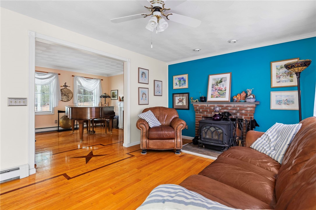 358 Shannock Road South Kingstown, RI 02879 - Photo 19 of 49 The family room features a wood stove.