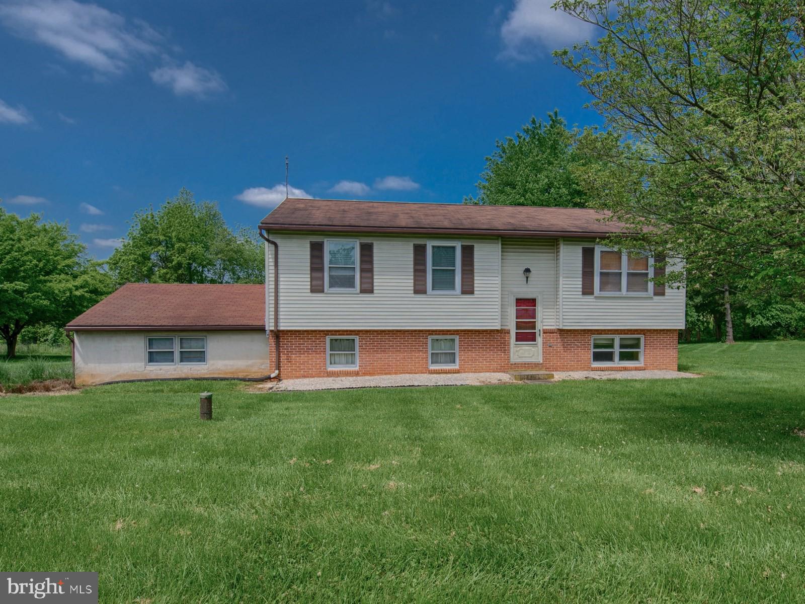 10 Wesley Road Quarryville, PA 17566 - Photo 1 of 25 a view of a house with a backyard