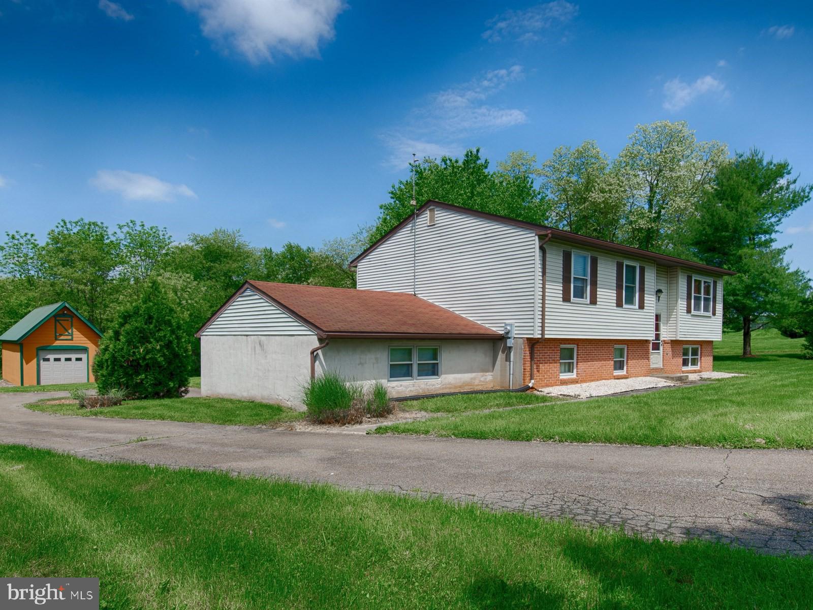 10 Wesley Road Quarryville, PA 17566 - Photo 2 of 25 a front view of a house with a yard and trees