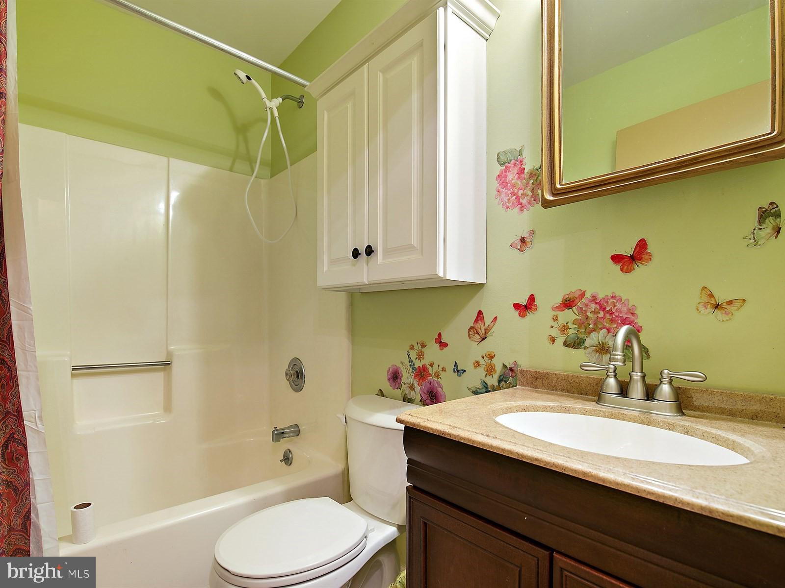 10 Wesley Road Quarryville, PA 17566 - Photo 11 of 25 a bathroom with a granite countertop sink toilet and shower
