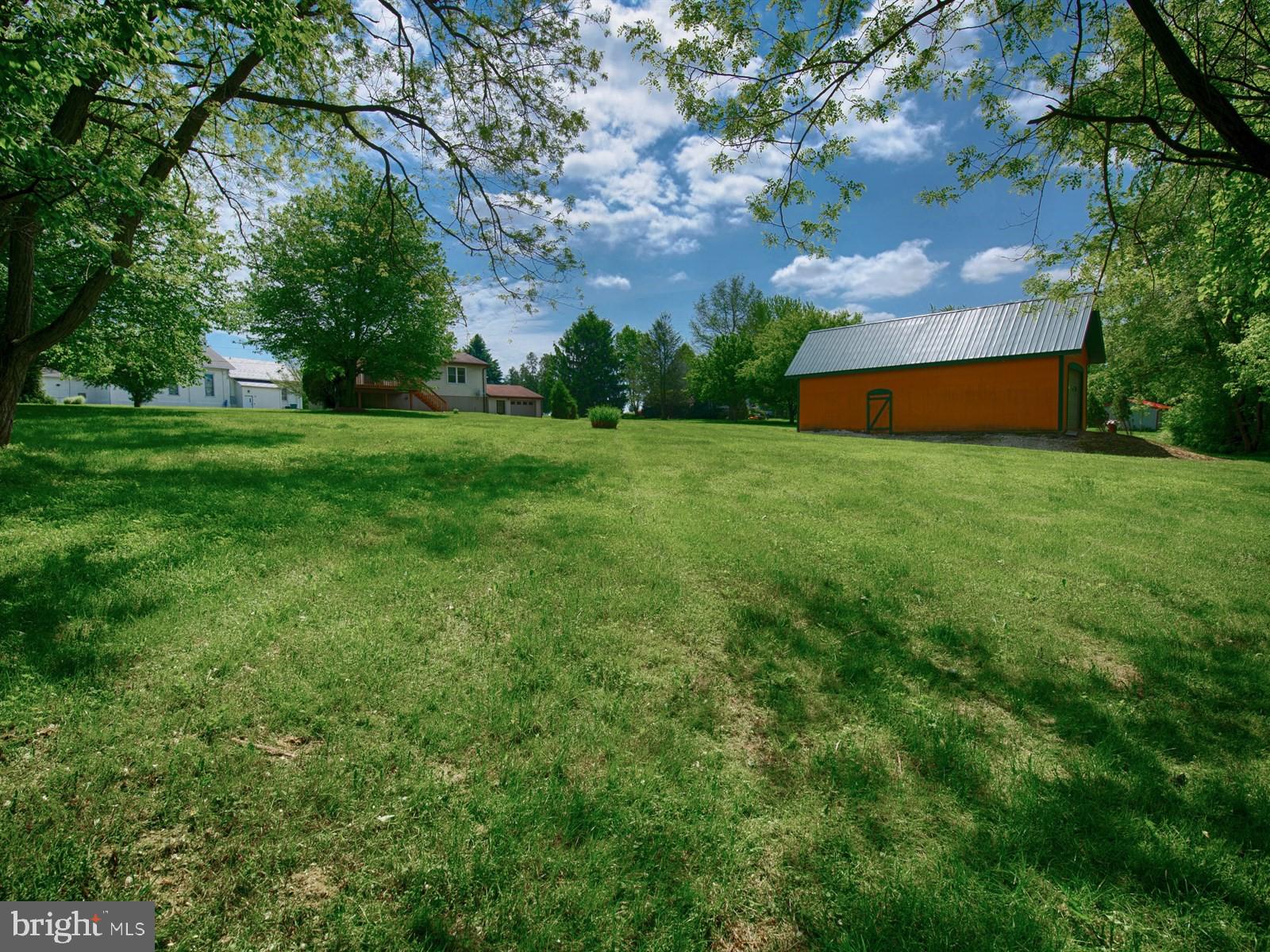 10 Wesley Road Quarryville, PA 17566 - Photo 21 of 25 a backyard of a house with lots of green space