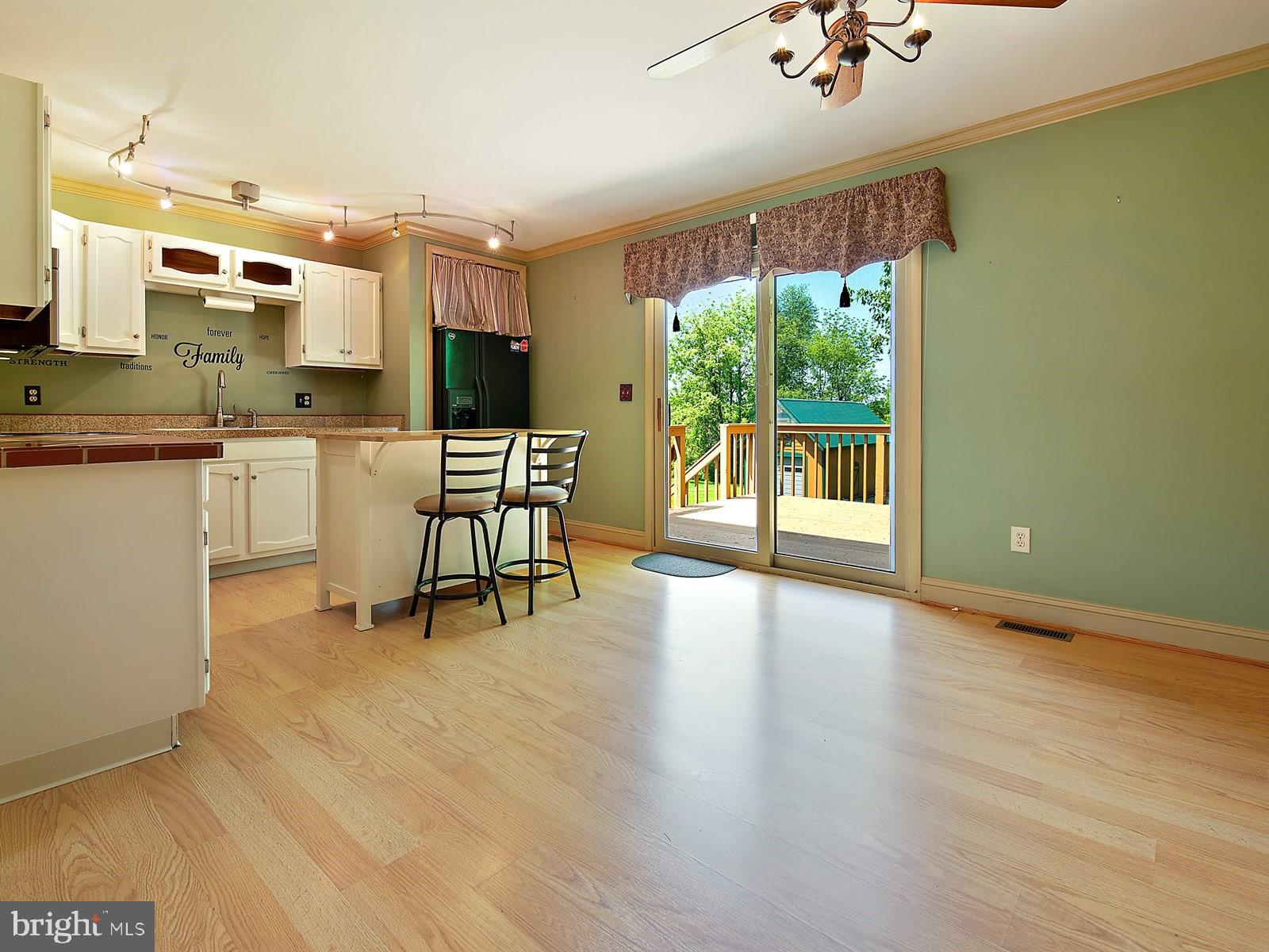 10 Wesley Road Quarryville, PA 17566 - Photo 5 of 25 a dining room with furniture a rug and wooden floor