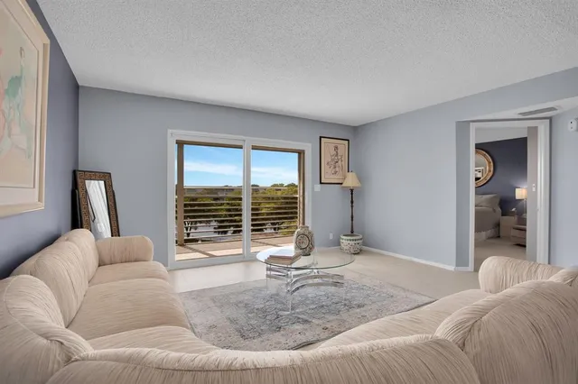 a living room with a couch and a large window