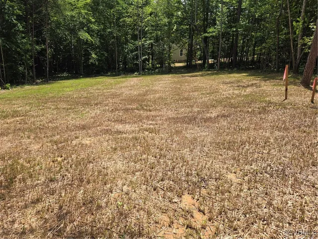 a view of swimming pool with a yard