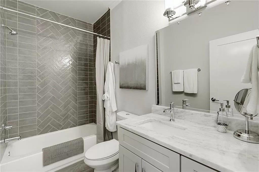 1217 Eleanor Street Austin, TX 78721 - Photo 13 of 17 Bathroom featuring shower / bath combination with curtain and vanity