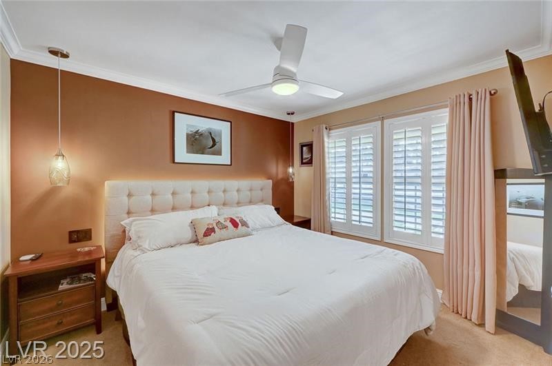 2410 Doherty Way Henderson, NV 89014 - Photo 29 of 63 Bedroom featuring ornamental molding, light carpet, and ceiling fan