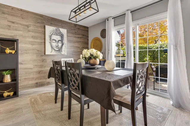 a dining room with furniture and window