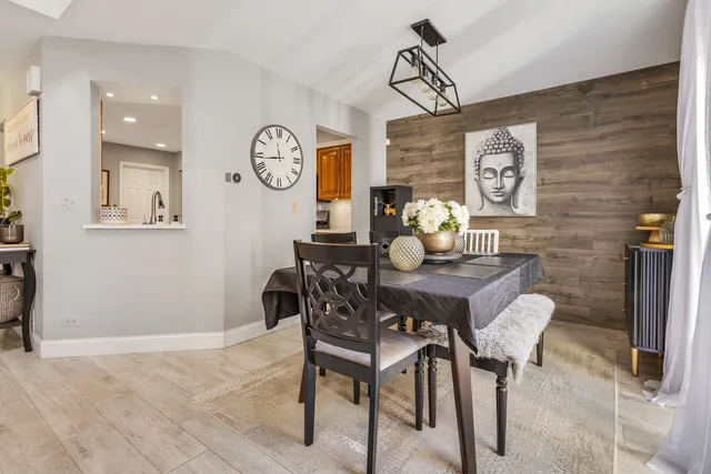 a dining room with furniture and window