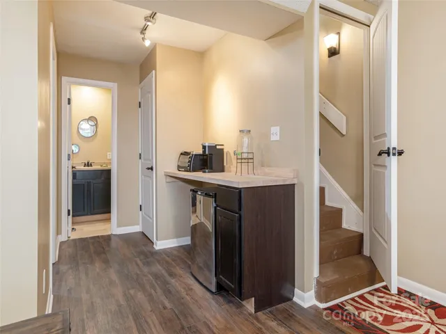 a kitchen with stainless steel appliances granite countertop a refrigerator and a sink