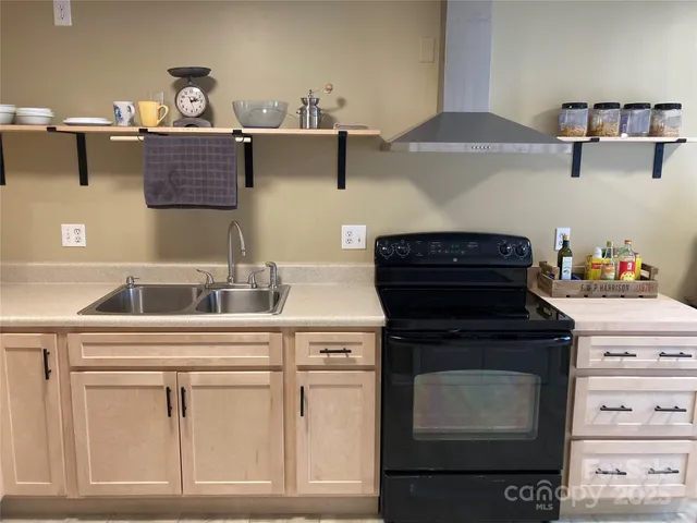 a kitchen with cabinets and appliances