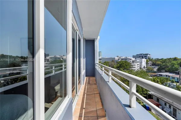 a view of balcony with furniture