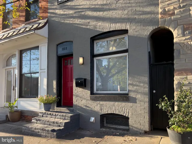 a front view of a house with a porch